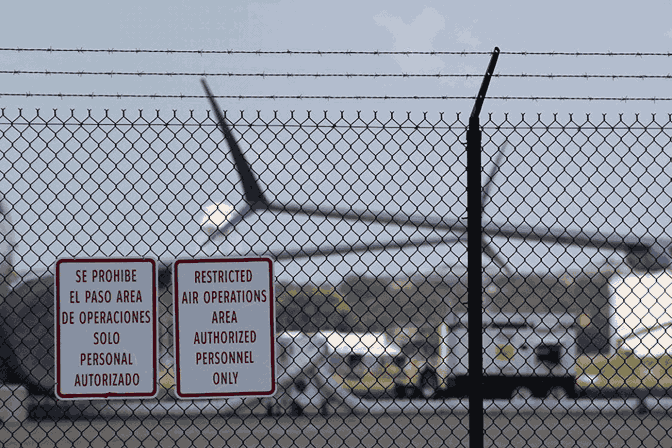 fence-with-signs-to-keep-out-of-a-restricted-area