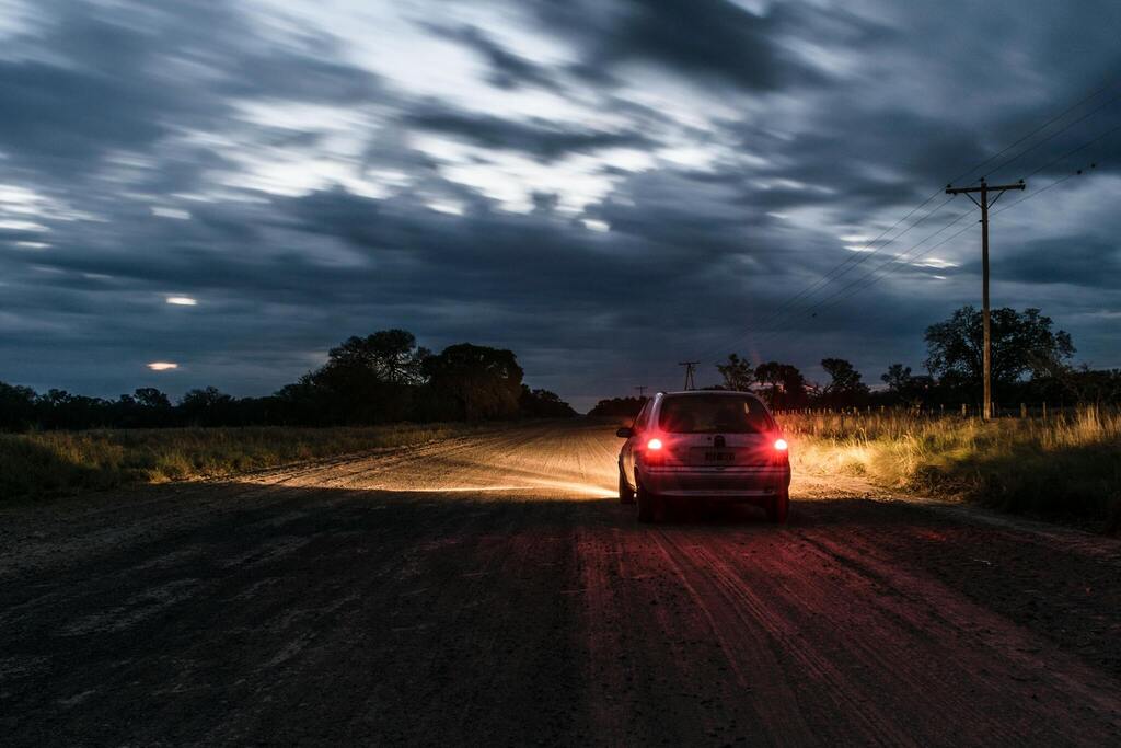 car-driving-down-a-dirt-road