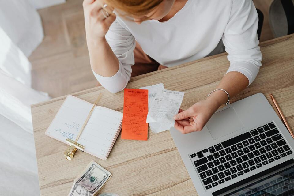 woman-looking-over-her-receipts