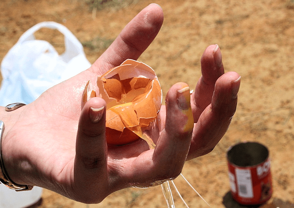 A man efficiently manages kitchen waste using the Food Waste Log