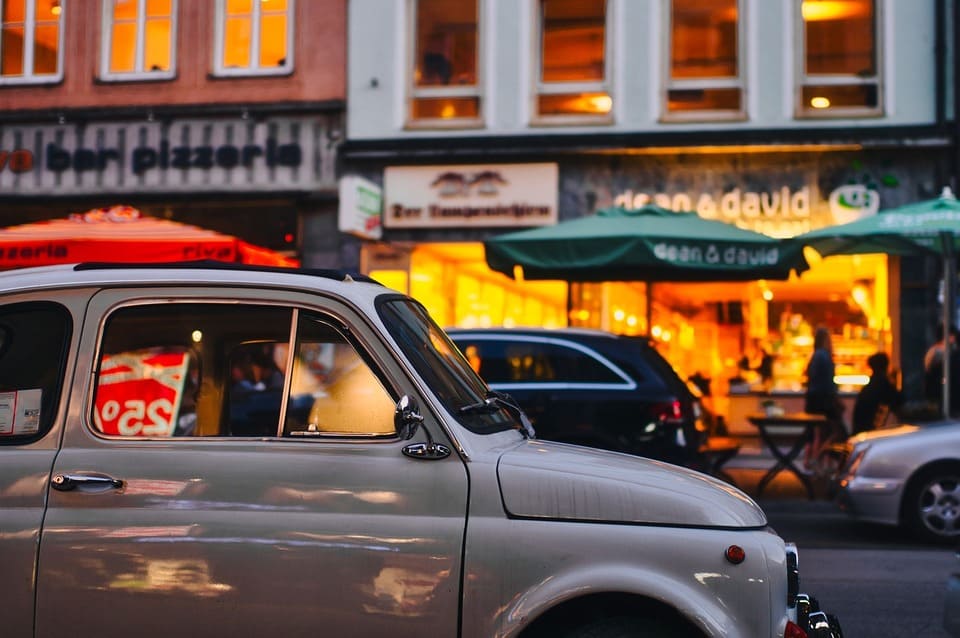 car-driving-through-a-busy-street