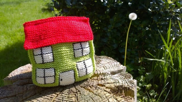 knitted-house-on-top-of-a-log