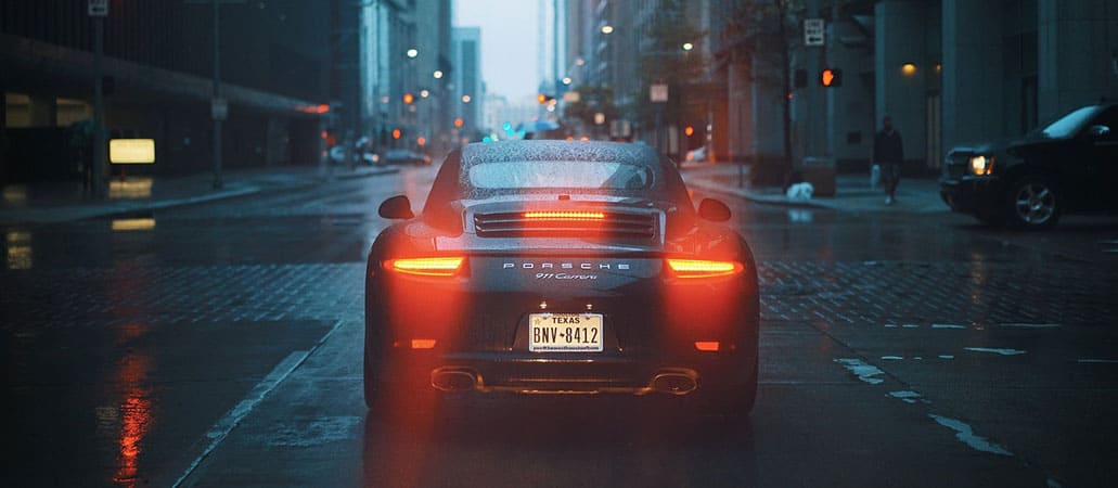 car-driving-down-a-wet-street